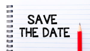 Save The Date Text written on notebook page, red pencil on the right. Motivational Concept image