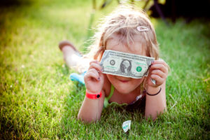 money, green, little girl, grass, dollar bill